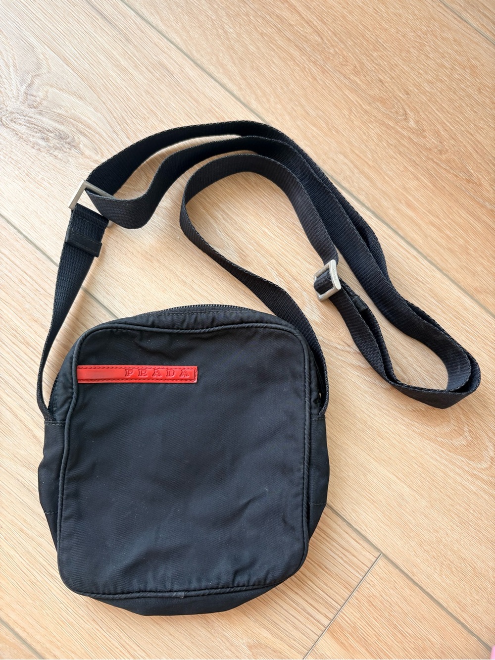 Prada Black Crossbody Bag with Red Logo Accent